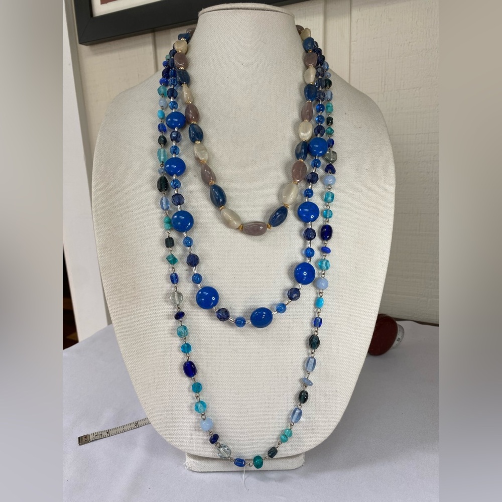 Group of three blue tone necklaces